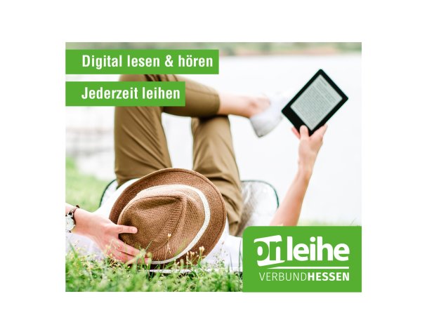 Mensch liegt lesend im Gras